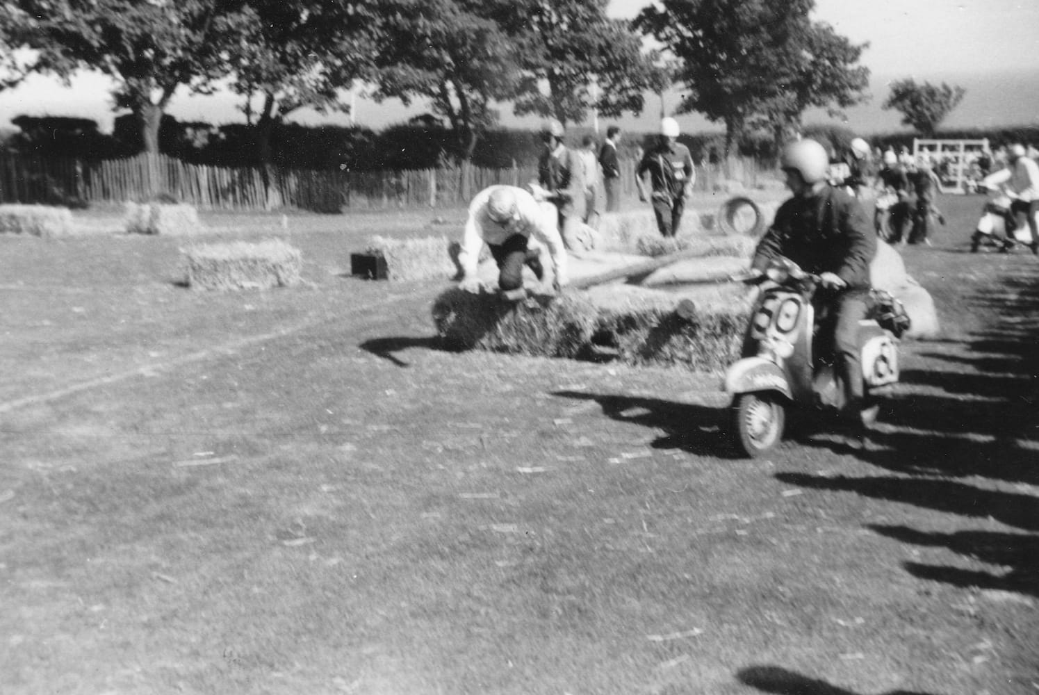 Tony Simpkins (50) waiting for a scrambling Dave Oldland